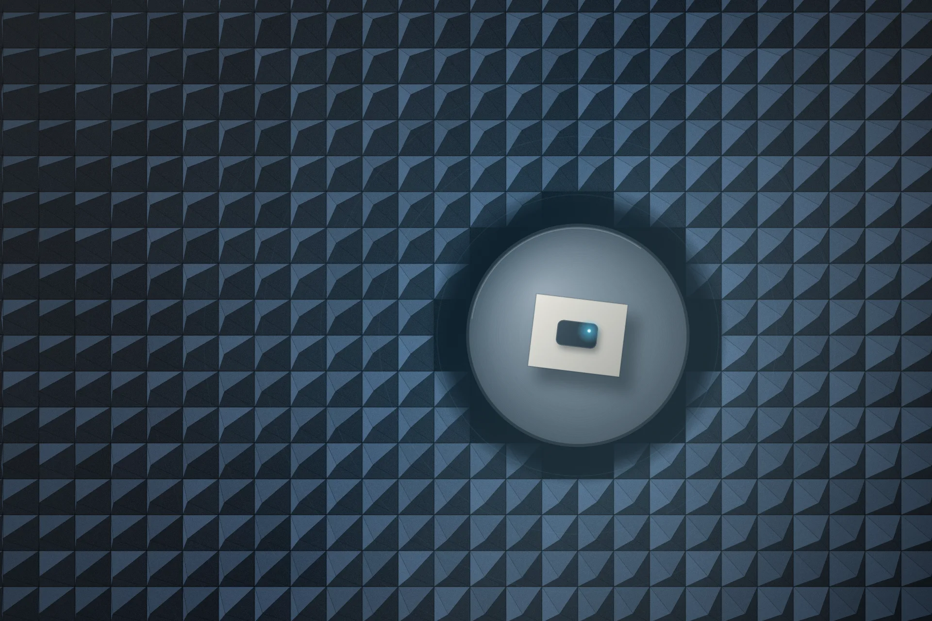 Procedural illustration: an overhead view of a radio test chamber floor covered in rows of slate-blue pyramid foam absorbers, around a bare metal turntable holding one small device with a blue status light.